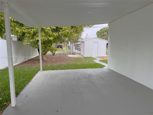 view of patio featuring a storage unit