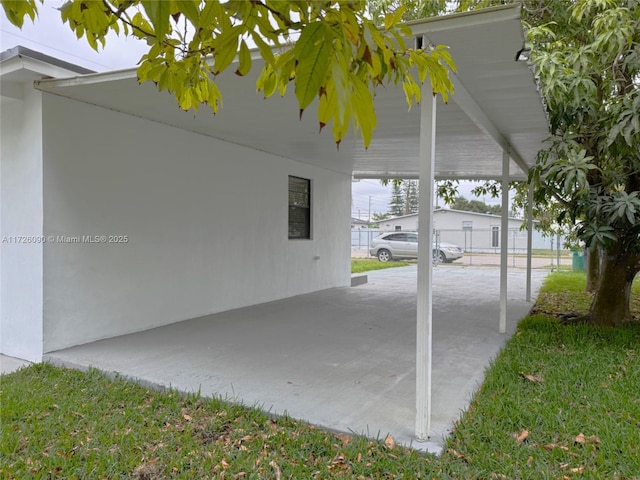 view of patio / terrace featuring a carport