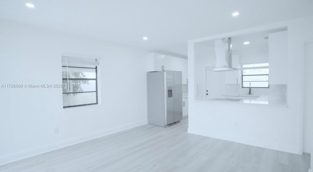 spare room featuring light hardwood / wood-style flooring