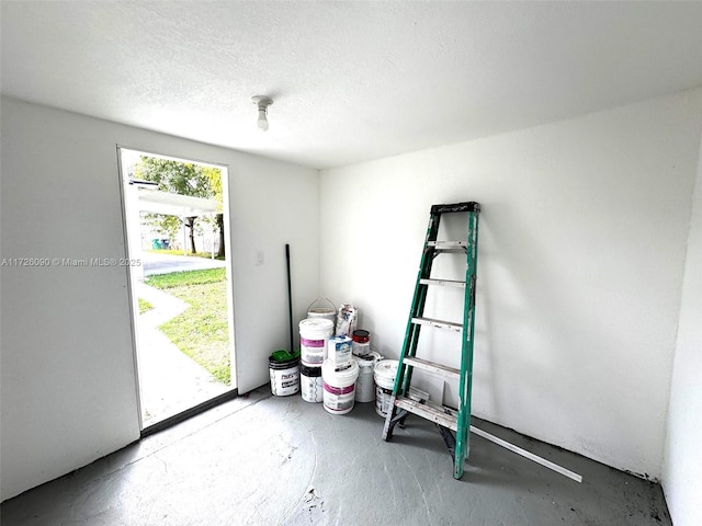 spare room with concrete flooring