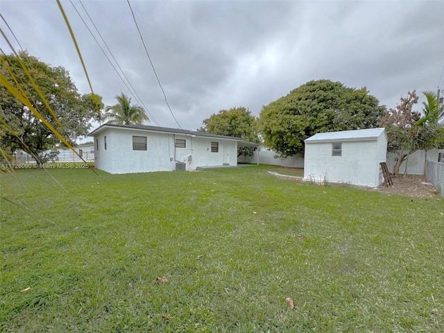 rear view of property with a yard