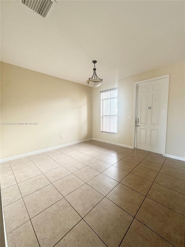 view of tiled spare room