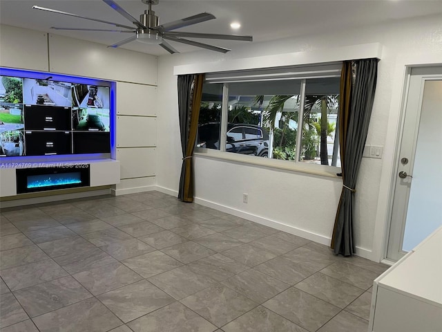 tiled living room featuring ceiling fan