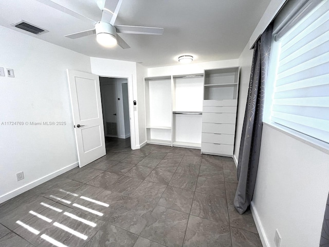 unfurnished bedroom featuring a closet and ceiling fan