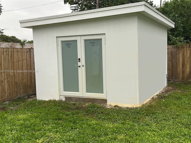 view of outbuilding with a yard