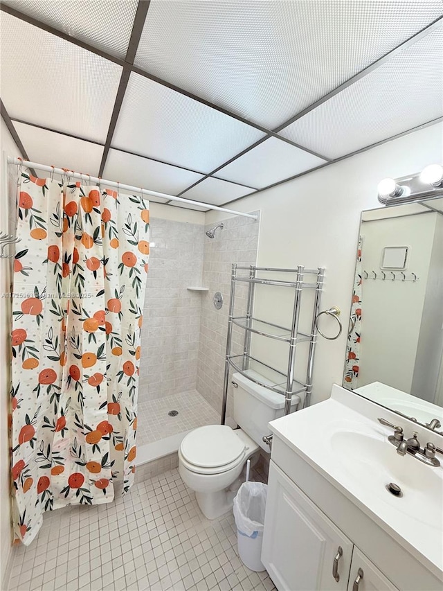 bathroom featuring tile patterned flooring, vanity, toilet, and a shower with shower curtain