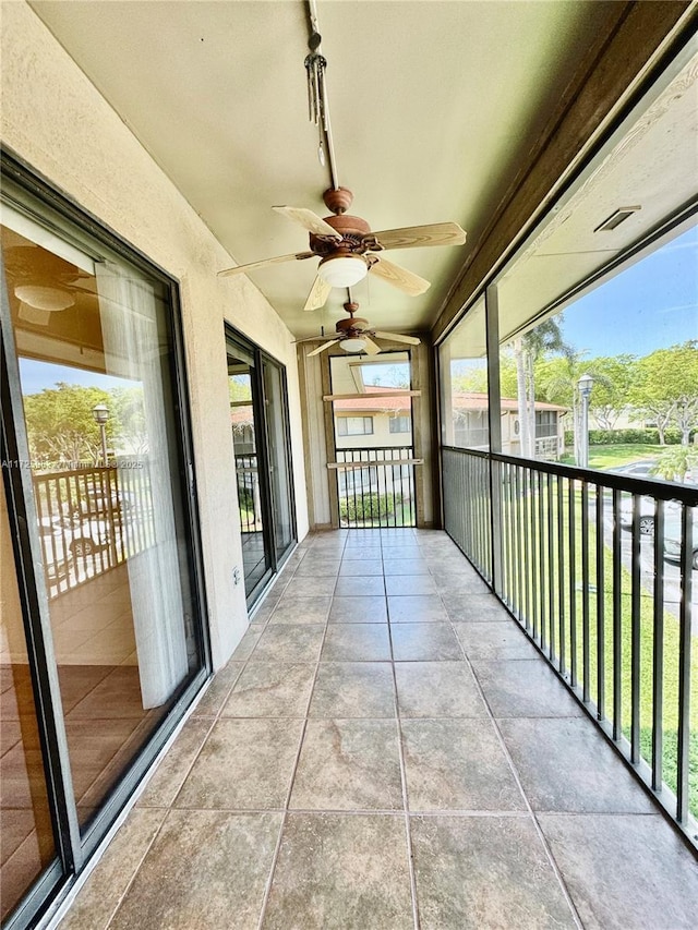 balcony featuring ceiling fan