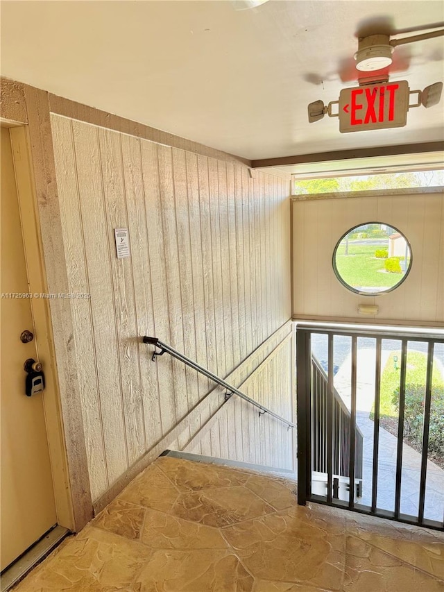 stairway with wooden walls