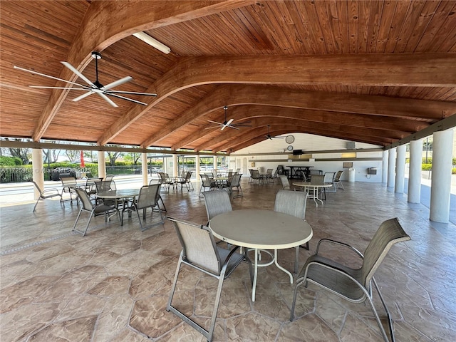 view of patio / terrace featuring vaulted ceiling with beams, wood ceiling, and a wealth of natural light