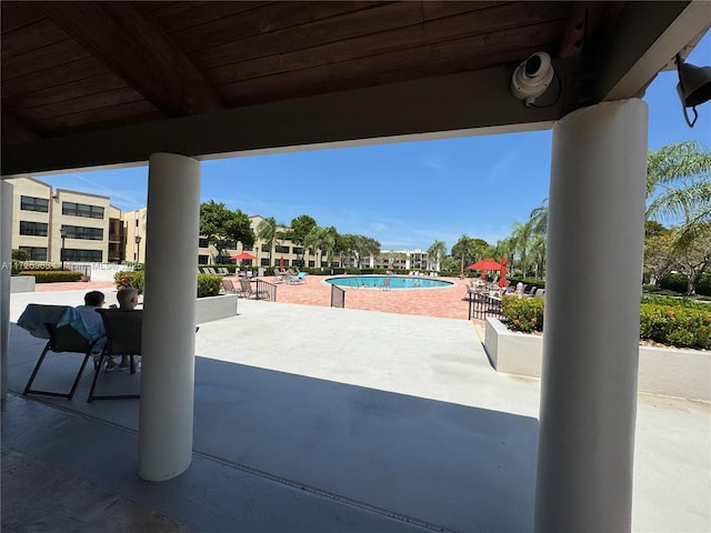 view of patio with a community pool