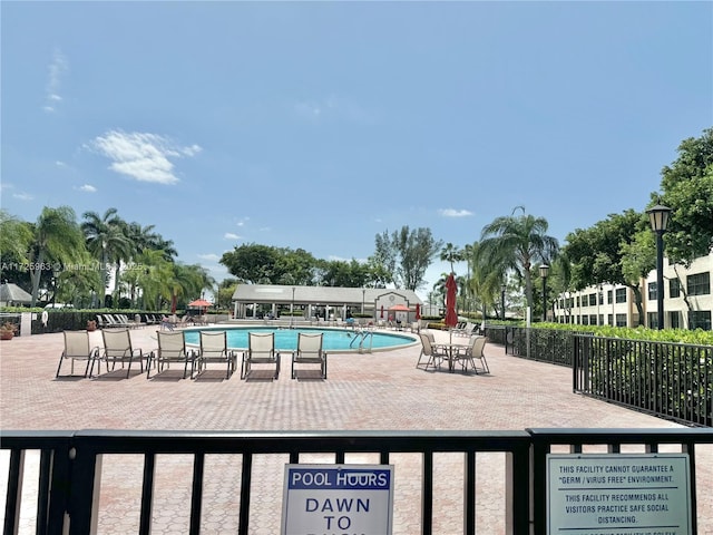 view of pool featuring a patio