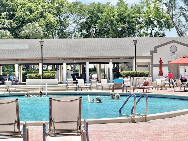 view of swimming pool featuring a patio area