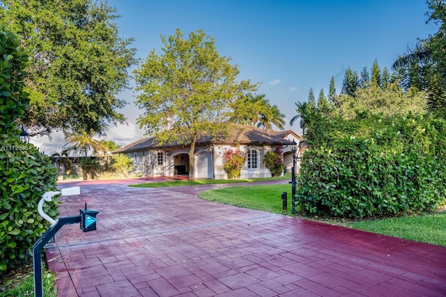 exterior space with decorative driveway