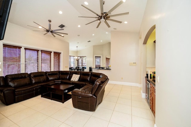 living area featuring light tile patterned floors, ceiling fan, visible vents, and recessed lighting