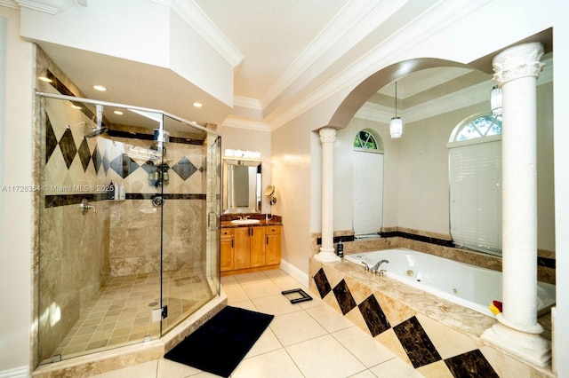 bathroom with a shower stall, decorative columns, vanity, and a tub with jets