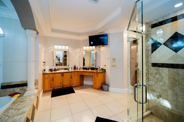 bathroom with ornamental molding, a sink, a shower stall, and ornate columns