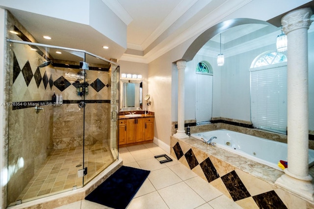 bathroom with a tub with jets, a shower stall, decorative columns, and crown molding