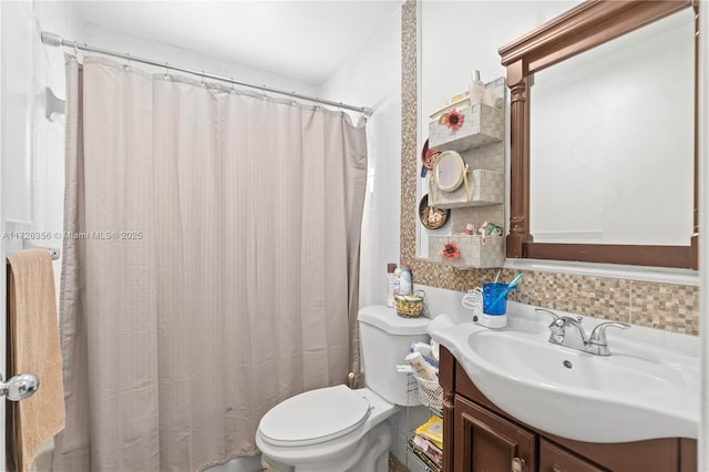 bathroom with curtained shower, toilet, vanity, and tasteful backsplash