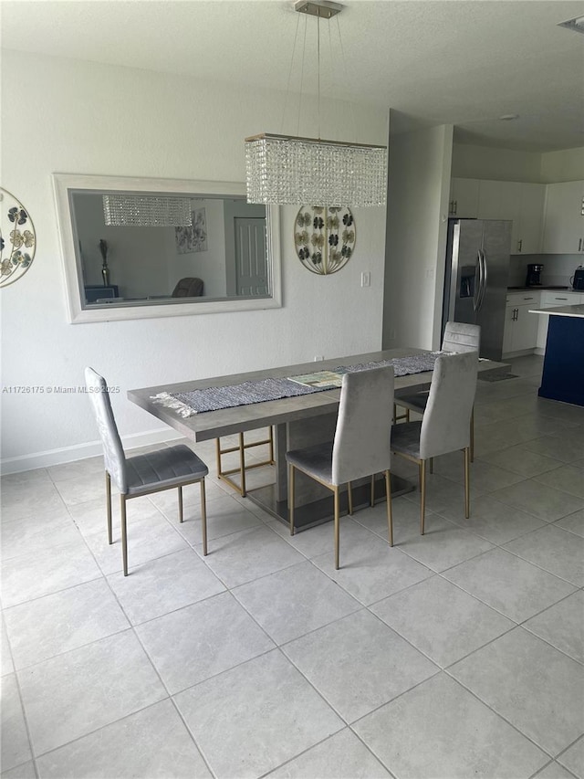 dining area featuring light tile patterned floors