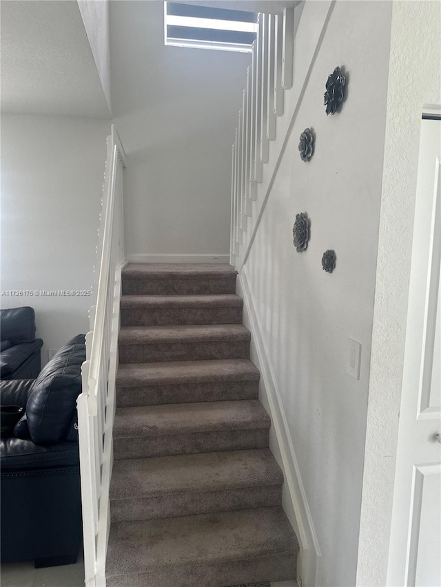 stairway with carpet floors