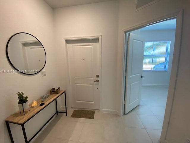 view of tiled foyer entrance