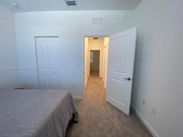 bedroom featuring a closet and carpet