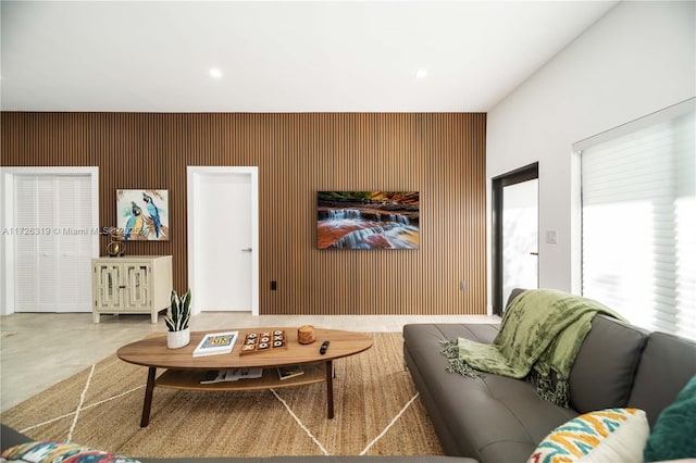 living room with wooden walls