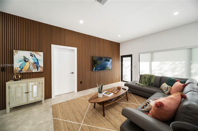 living room featuring wood walls