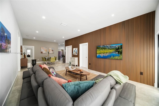 living room with wooden walls