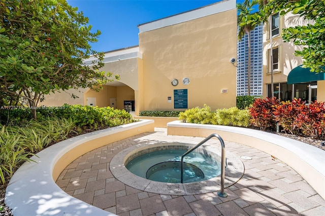 view of pool featuring a community hot tub