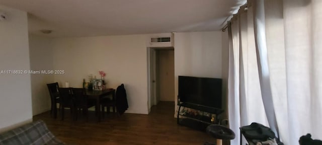 living room featuring dark wood-type flooring