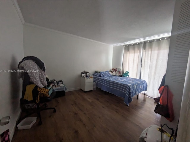 bedroom featuring crown molding and dark hardwood / wood-style floors