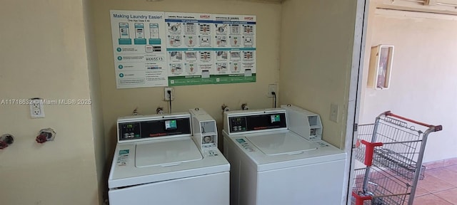 laundry area featuring independent washer and dryer and light tile patterned floors