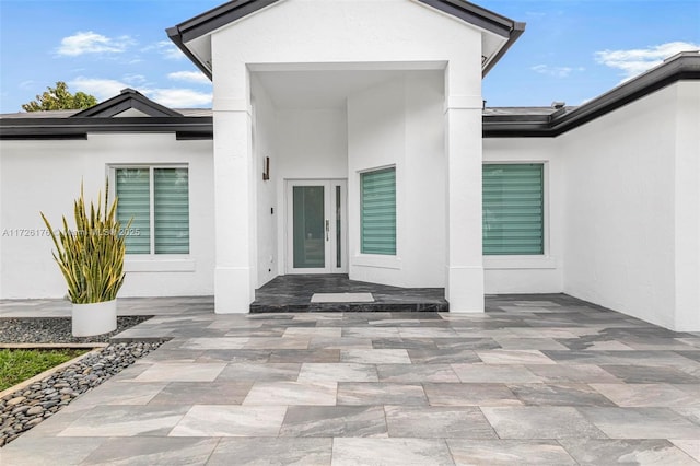 entrance to property with a patio