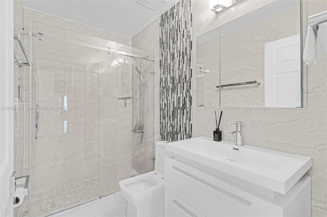 bathroom featuring toilet, vanity, tile walls, and walk in shower