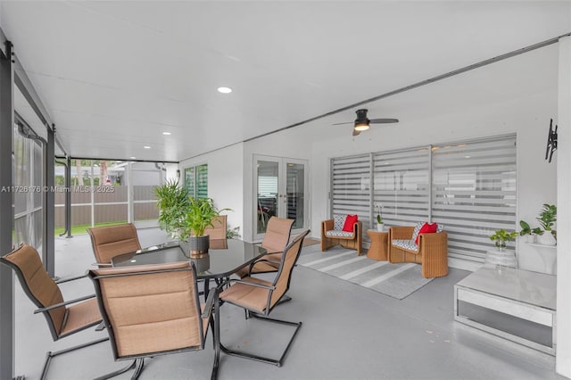 sunroom featuring ceiling fan