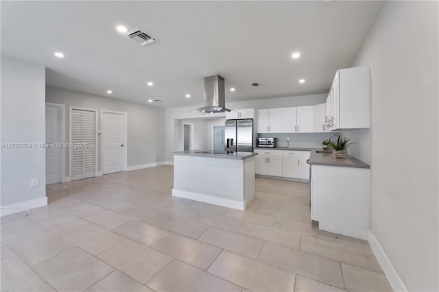 kitchen with white cabinetry, black electric cooktop, stainless steel refrigerator with ice dispenser, a kitchen island, and island range hood