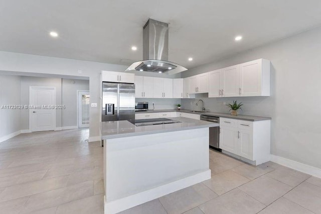 kitchen with island range hood, a kitchen island, white cabinets, appliances with stainless steel finishes, and sink