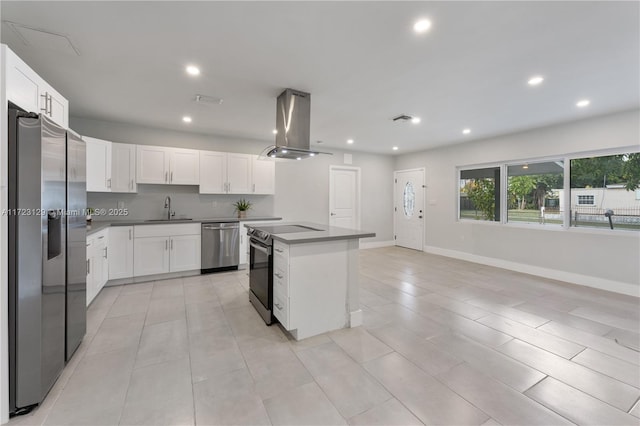 kitchen with island range hood, stainless steel appliances, a center island, sink, and white cabinetry