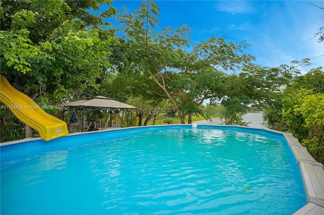 view of pool featuring a playground