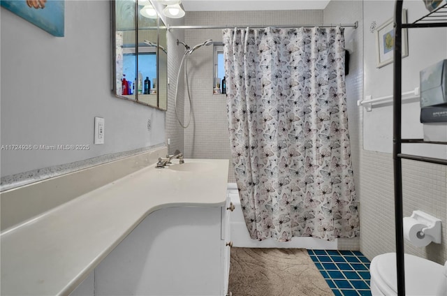 full bathroom with shower / bath combination with curtain, tile patterned floors, vanity, and toilet