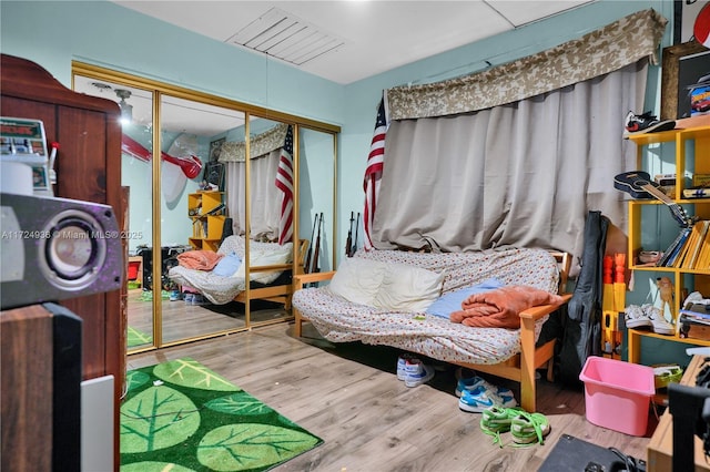 bedroom featuring a closet and hardwood / wood-style flooring