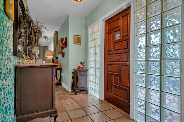 entryway featuring light tile patterned flooring