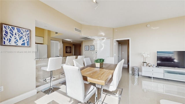 dining room with light tile patterned flooring