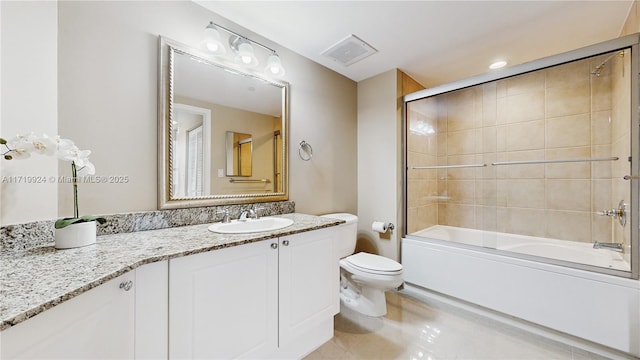 full bathroom with enclosed tub / shower combo, vanity, toilet, and tile patterned flooring