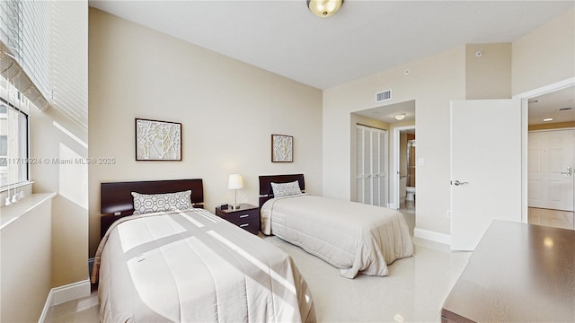 bedroom featuring a closet and ensuite bathroom