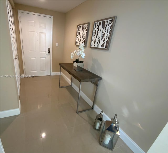 doorway to outside featuring light tile patterned floors