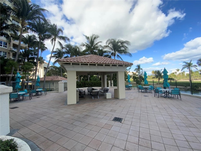 view of patio / terrace with a gazebo and a water view