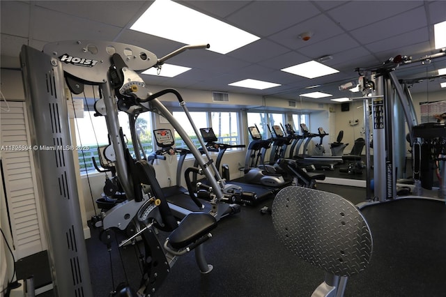 exercise room with a drop ceiling