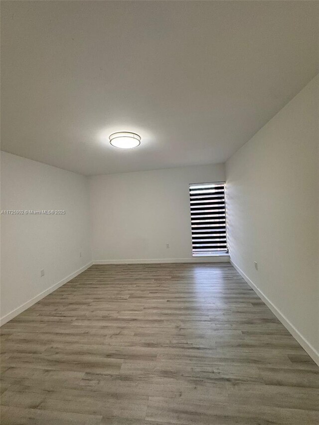 spare room with light wood-type flooring